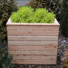 Shire Pia Larchwood Planter - in situ, front view, plants