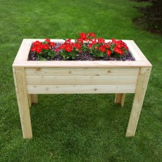 Shire Stef Larchwood Planter - in situ, front view, flowers