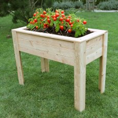 Shire Stef Larchwood Planter - in situ, angle view, tomatos