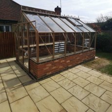 Elite Titan 800 8x12 Greenhouse in stone built on a dwarf wall - side view